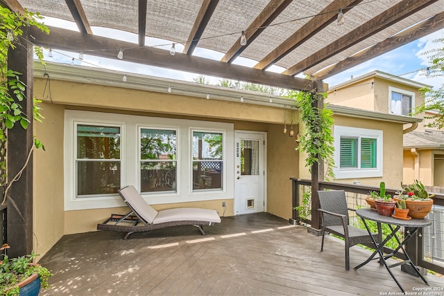 wooden terrace with a pergola