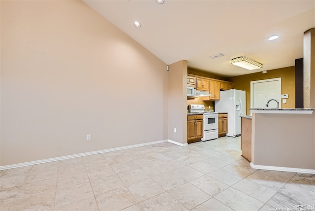 kitchen with white appliances, lofted ceiling, ventilation hood, and sink