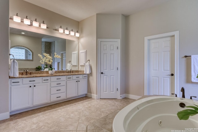 bathroom featuring vanity and a bath