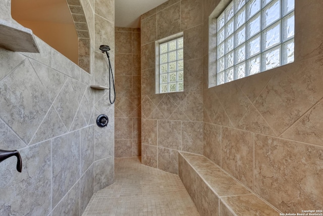 bathroom featuring tiled shower