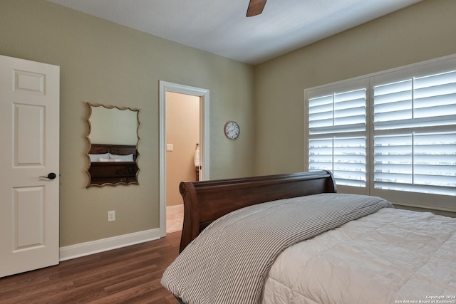 bedroom featuring ceiling fan and dark wood-type flooring