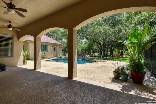 view of pool with ceiling fan and a patio area