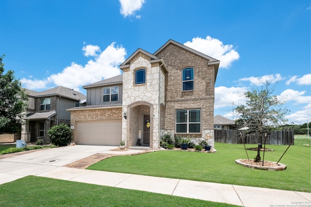 front facade featuring a front yard and a garage