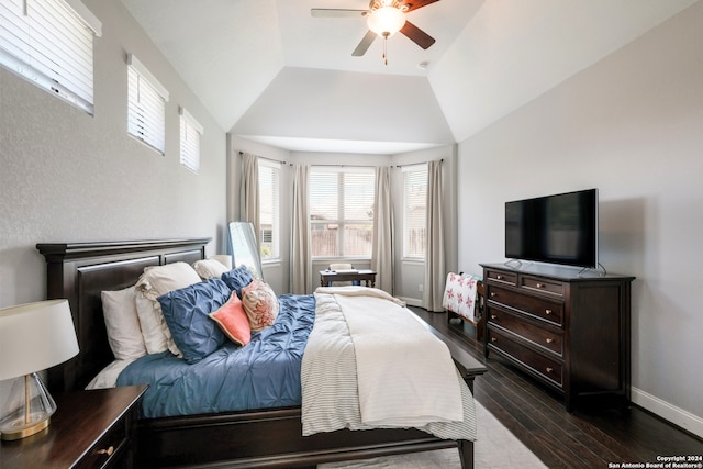 bedroom with ceiling fan, dark hardwood / wood-style flooring, and vaulted ceiling