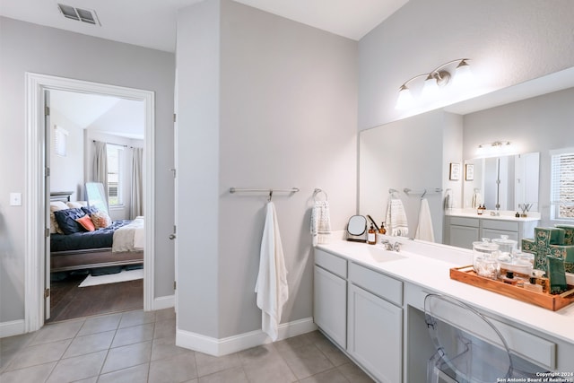 bathroom with tile patterned flooring and vanity