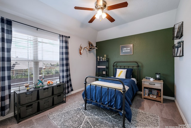 bedroom featuring ceiling fan, carpet, and vaulted ceiling