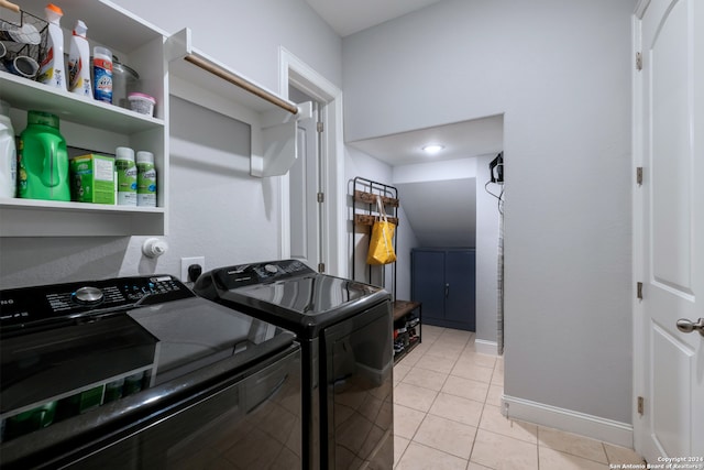 laundry room with light tile patterned floors and independent washer and dryer