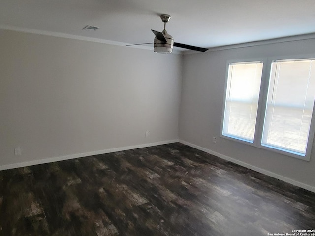 empty room featuring ceiling fan and dark hardwood / wood-style floors