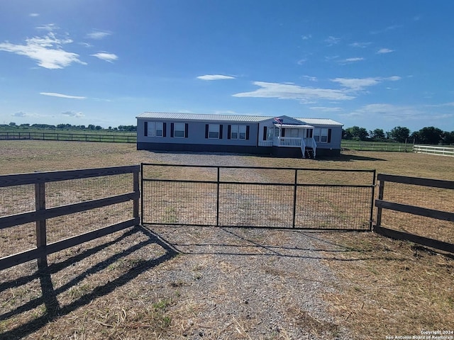 view of front of property featuring a rural view