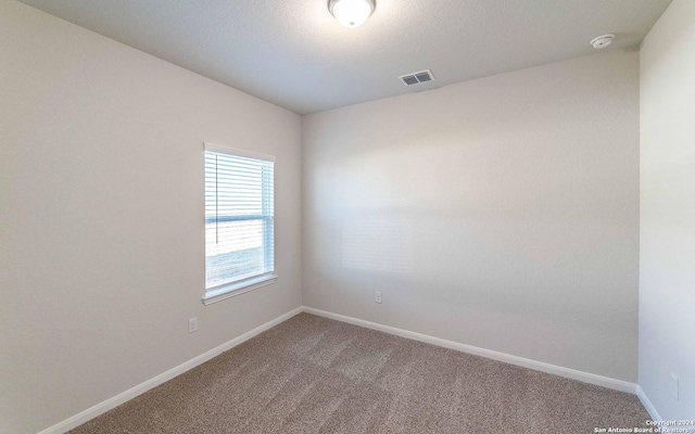 3569 Alto Stratus, New Braunfels, TX 78130 - carpeted empty room with visible vents and baseboards