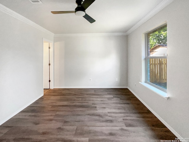 spare room with ornamental molding, ceiling fan, and dark hardwood / wood-style flooring