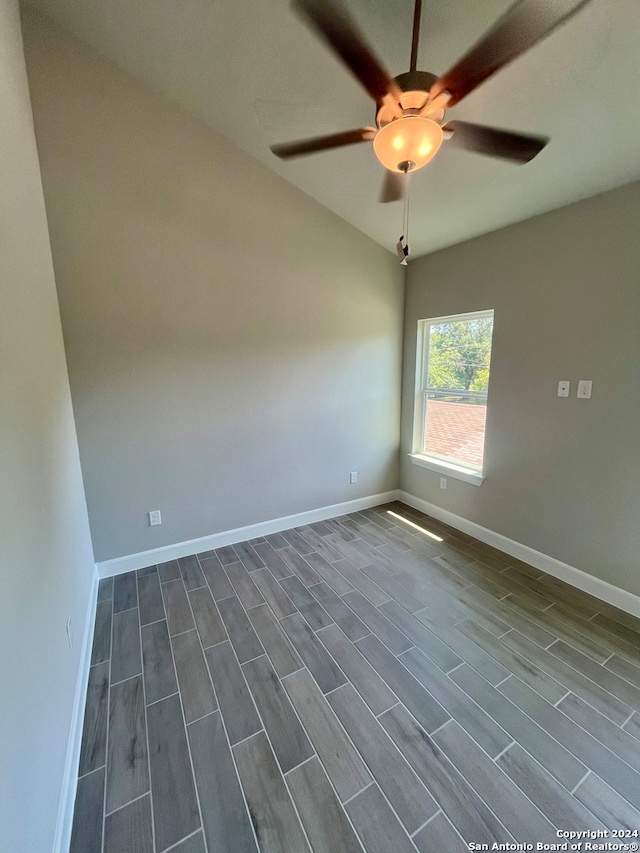 empty room featuring dark hardwood / wood-style flooring and ceiling fan