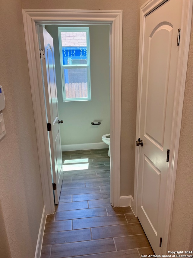 hall with dark hardwood / wood-style floors