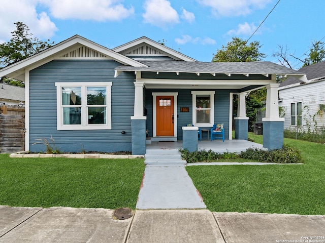 view of front of property with a front lawn and a porch