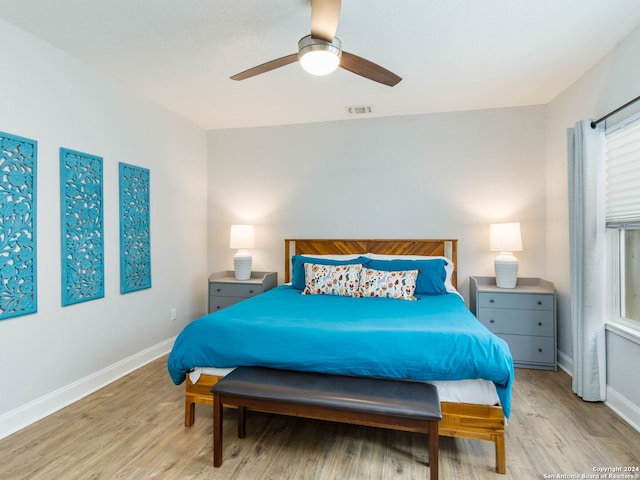 bedroom featuring ceiling fan and light hardwood / wood-style floors