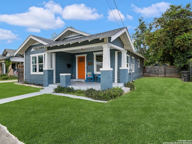 view of front of house featuring a porch and a front lawn