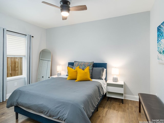 bedroom featuring ceiling fan and wood-type flooring