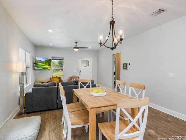 dining area featuring dark wood-type flooring and ceiling fan