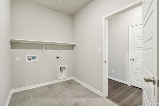 laundry area featuring gas dryer hookup, hookup for an electric dryer, laundry area, washer hookup, and baseboards