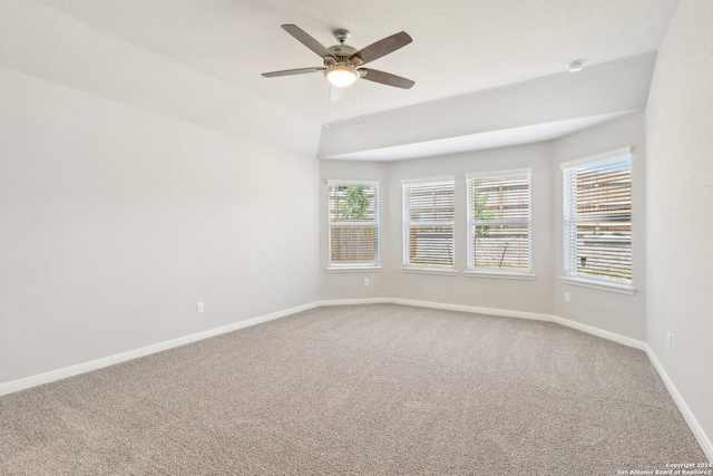 empty room featuring carpet, ceiling fan, and baseboards