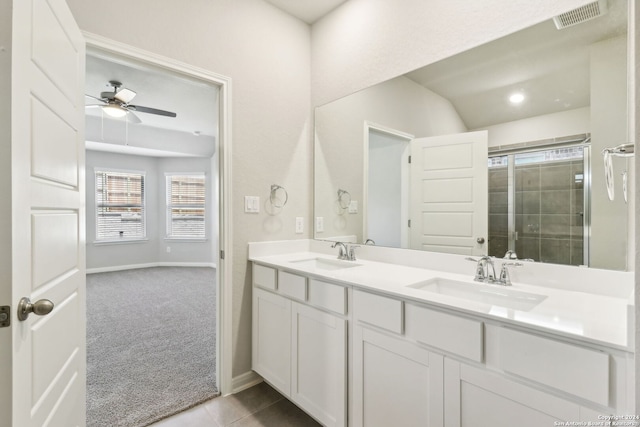 bathroom featuring double vanity, a sink, visible vents, and a ceiling fan