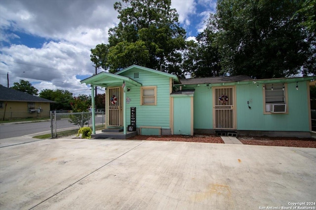 bungalow-style home featuring cooling unit