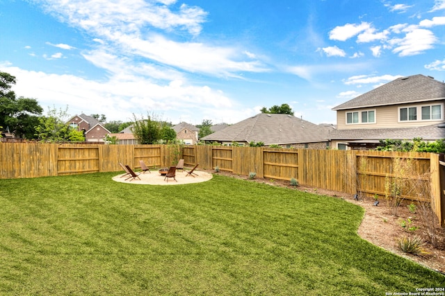 view of yard with an outdoor fire pit