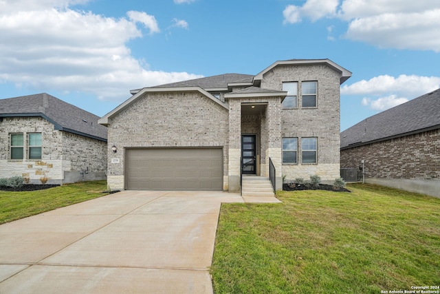 view of front of home featuring a front yard, a garage, and central air condition unit