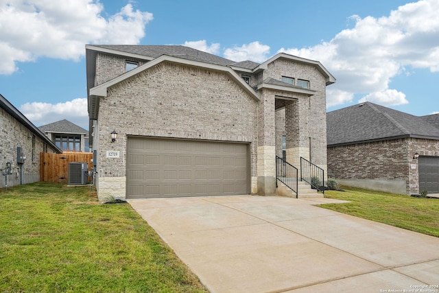 view of front of property with cooling unit and a front yard