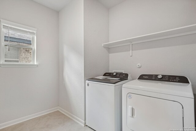 laundry room with washing machine and dryer