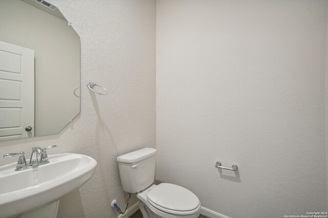 bathroom with sink and toilet