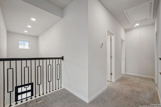 hallway with light carpet