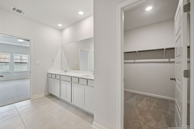 bathroom with tile patterned flooring and vanity