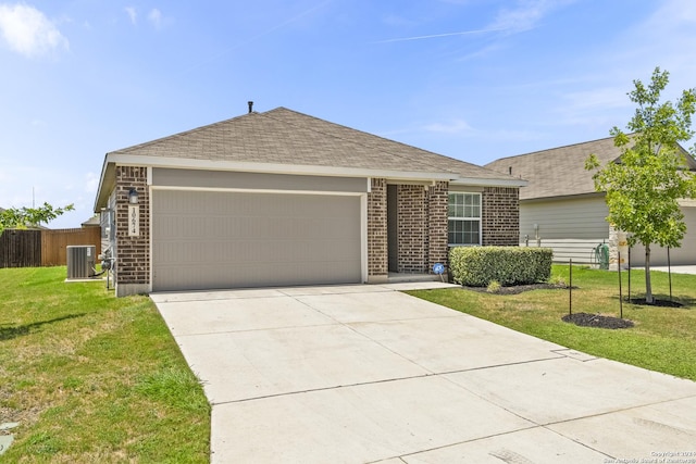 ranch-style house featuring a front lawn, a garage, and cooling unit