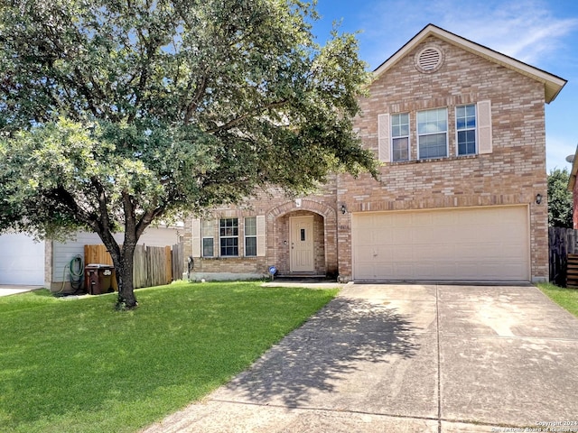 front facade featuring a garage and a front lawn