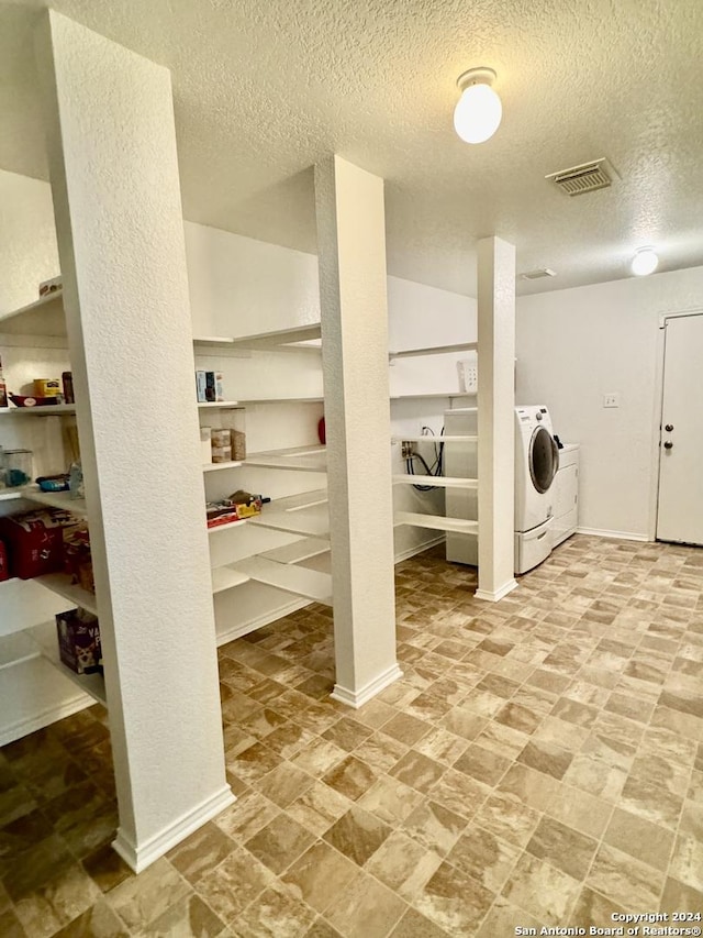 washroom featuring a textured ceiling