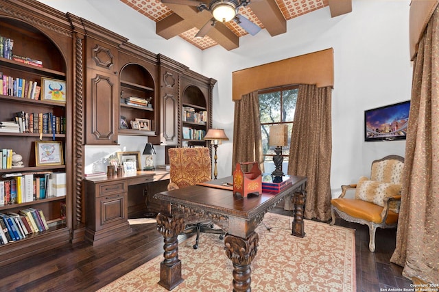 home office featuring beamed ceiling, dark hardwood / wood-style flooring, ceiling fan, and brick ceiling