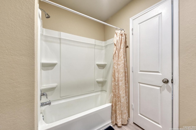 bathroom featuring shower / bath combination with curtain and wood-type flooring