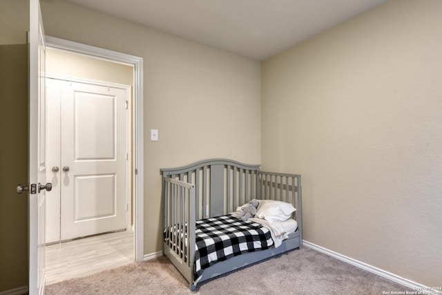 bedroom with light colored carpet