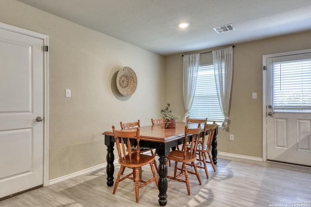 dining space featuring light hardwood / wood-style flooring