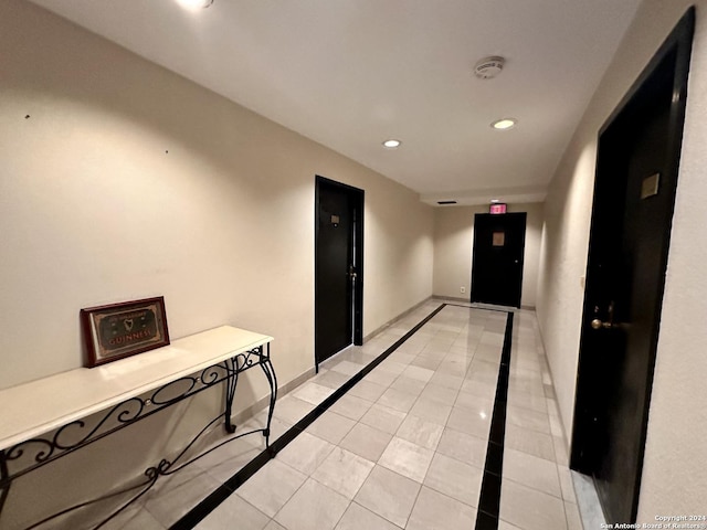 corridor with light tile patterned floors