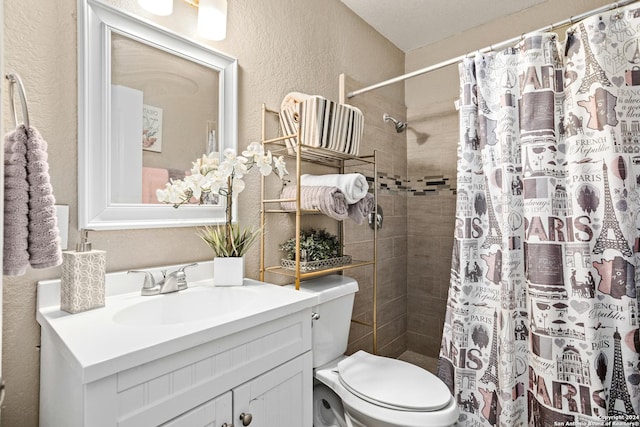 bathroom featuring a shower with curtain, vanity, and toilet