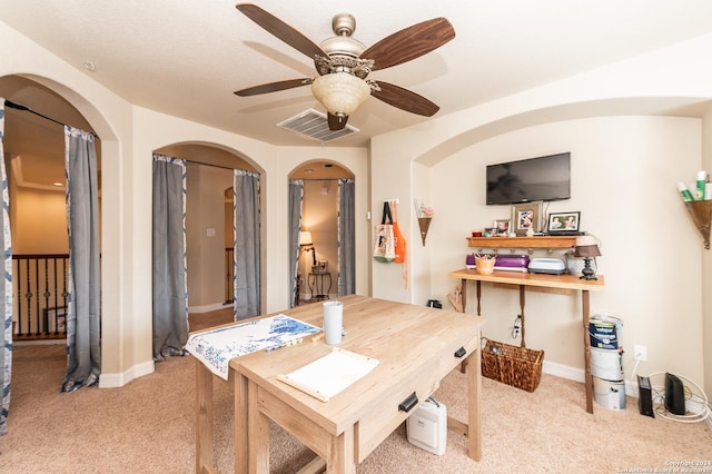 dining room featuring ceiling fan and light colored carpet