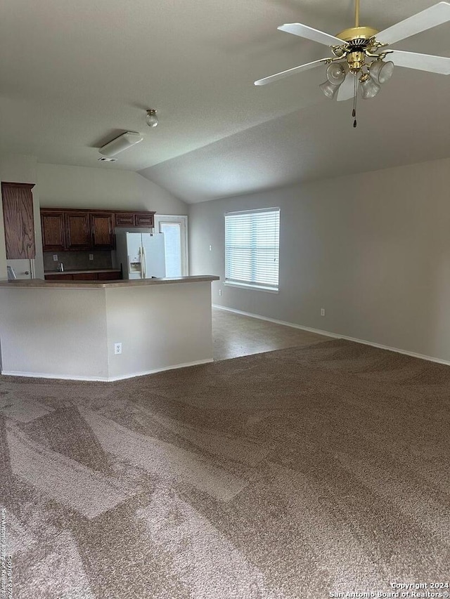 unfurnished living room with carpet, ceiling fan, and lofted ceiling