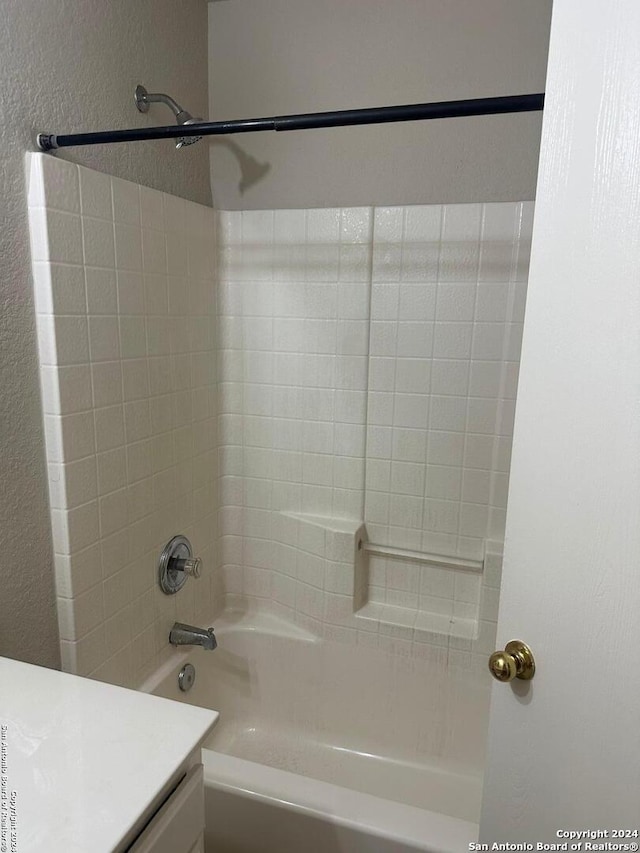 bathroom featuring vanity and tiled shower / bath combo