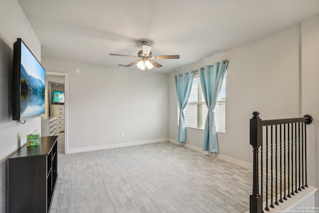 living room featuring carpet floors and ceiling fan