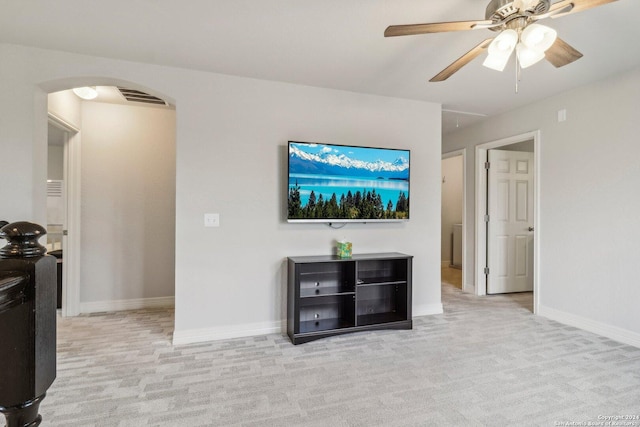 living room with light carpet and ceiling fan