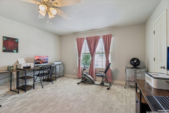 office area with ceiling fan and light carpet