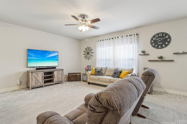 carpeted living room featuring ceiling fan