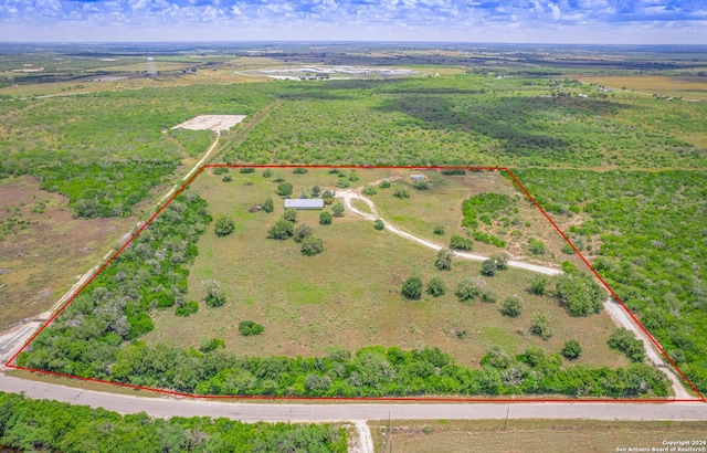 birds eye view of property with a rural view